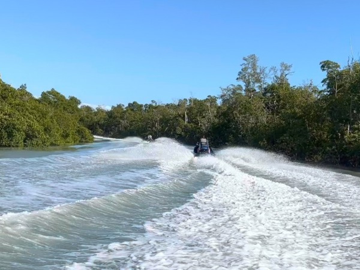 a man riding a wave on top of a body of water