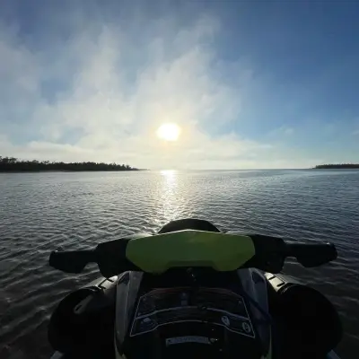 a person standing next to a body of water