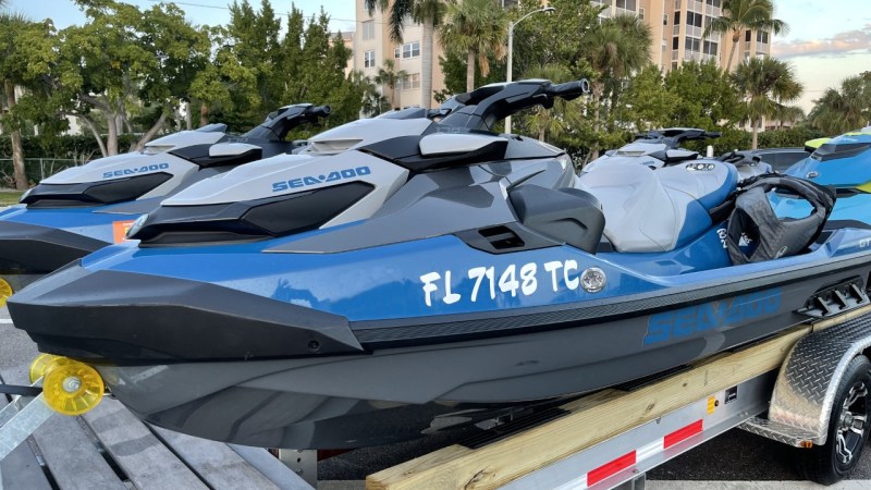 a blue car parked in a parking lot