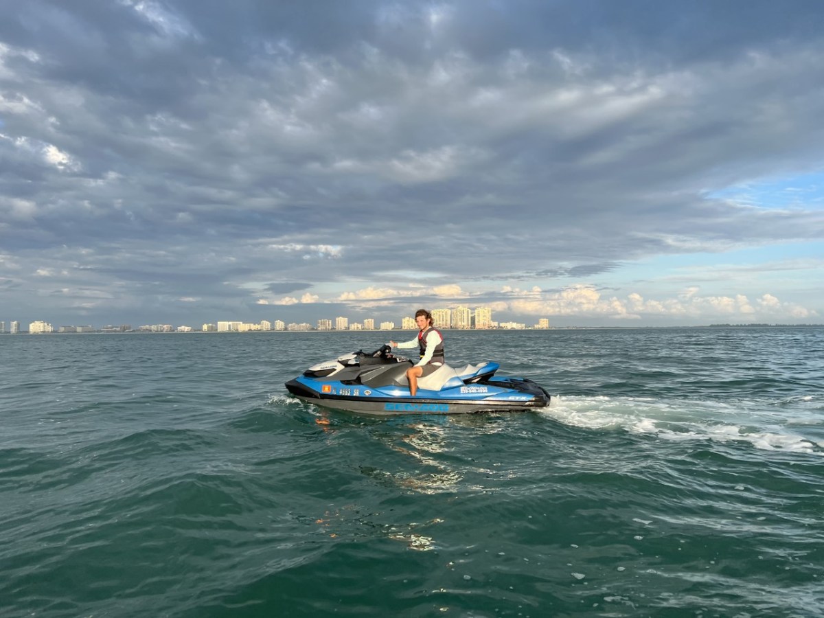 a person riding a surf board on a body of water