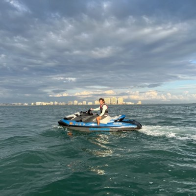a person riding a surf board on a body of water