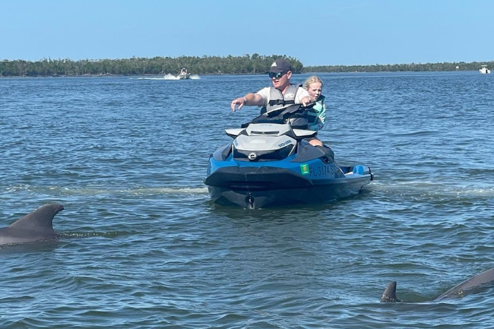 a man riding a jet ski in a body of water