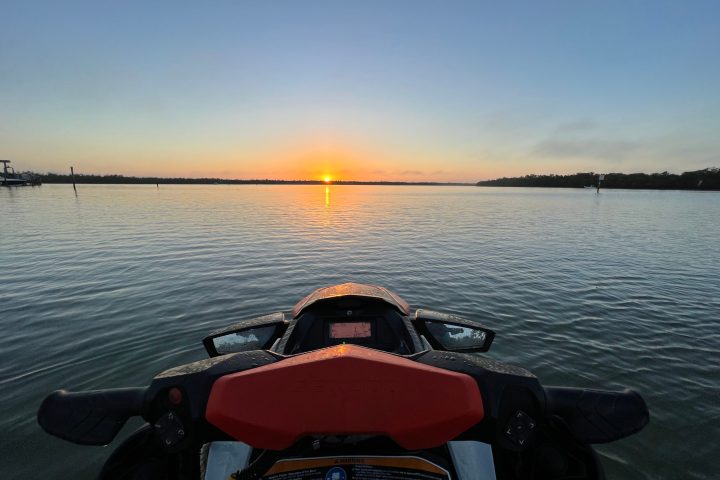 a boat sitting next to a body of water